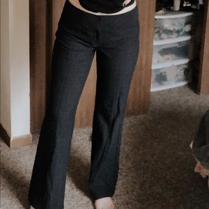 Dark blue flare pants with lines through them.